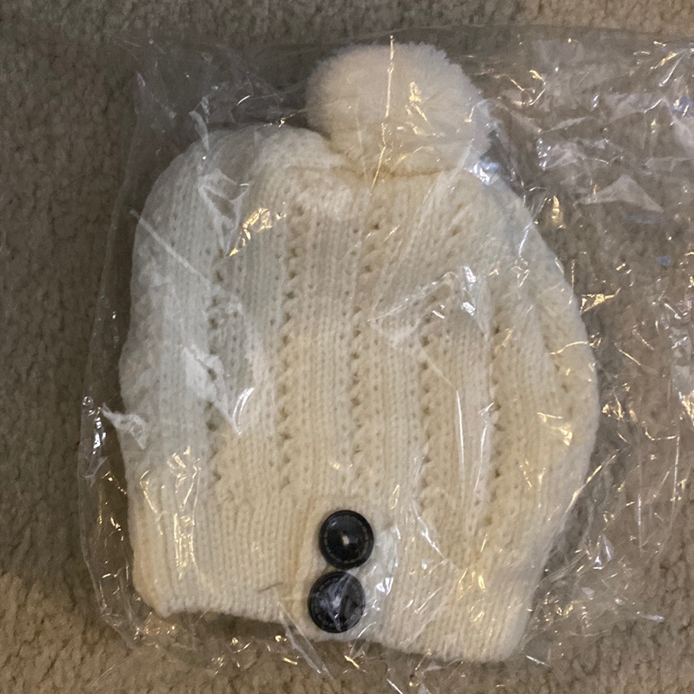 White beanie with black buttons